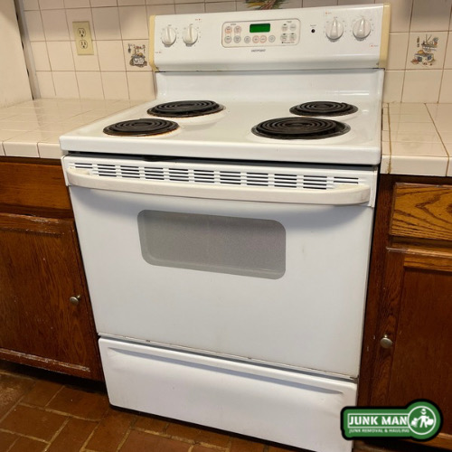 Electric stove removal in Kennesaw Georgia completed by Junk Man appliance removal specialists for residential kitchen clean out services.