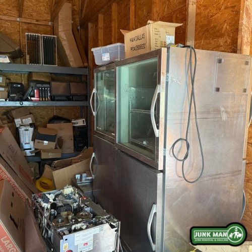 Commercial appliance removal in Kennesaw GA including oversized refrigerator and restaurant equipment hauled away by Junk Man.