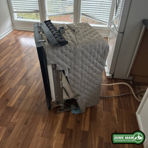 Dishwasher removal service in Kennesaw GA featuring appliance disconnect and haul away by junk man junk removal and hauling.