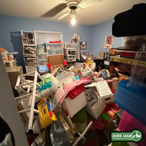 Hoarder junk removal in Kennesaw GA with cluttered room clean out services by junk man junk removal and hauling, including furniture removal, trash hauling, household debris clean up, and full hoarder property clean out solutions.