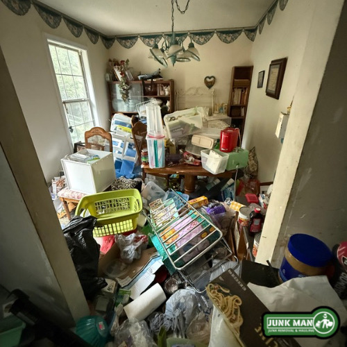 Dining room hoarder clean out in Kennesaw GA by junk man junk removal and hauling, including clutter cleanup, household junk hauling, trash removal, and full residential hoarder property clean outs.
