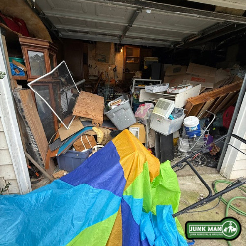 Kennesaw GA hoard clean out with garage Clean out services by junk man junk removal and hauling, Including furniture disposal, clutter removal, household junk hauling, debris cleanup, and full residential property cleanouts.