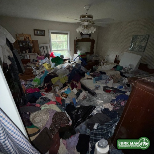 Hoarder junk removal in Kennesaw GA with bedroom clean out services by Junk man junk removal and hauling, including clutter removal, trash bag hauling, furniture disposal, and full residential order house cleanup services.